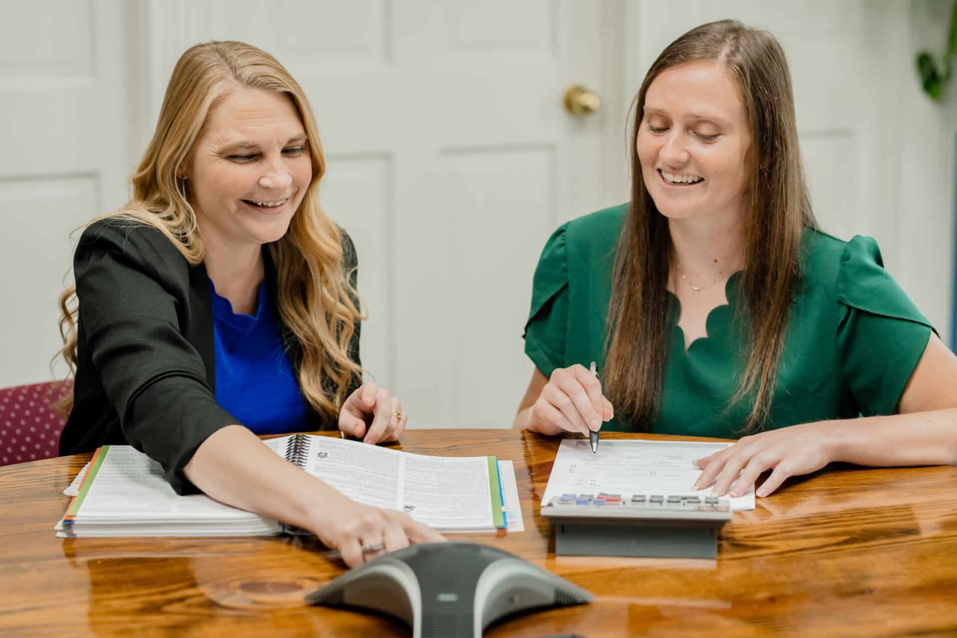 two women hanging up a conference call