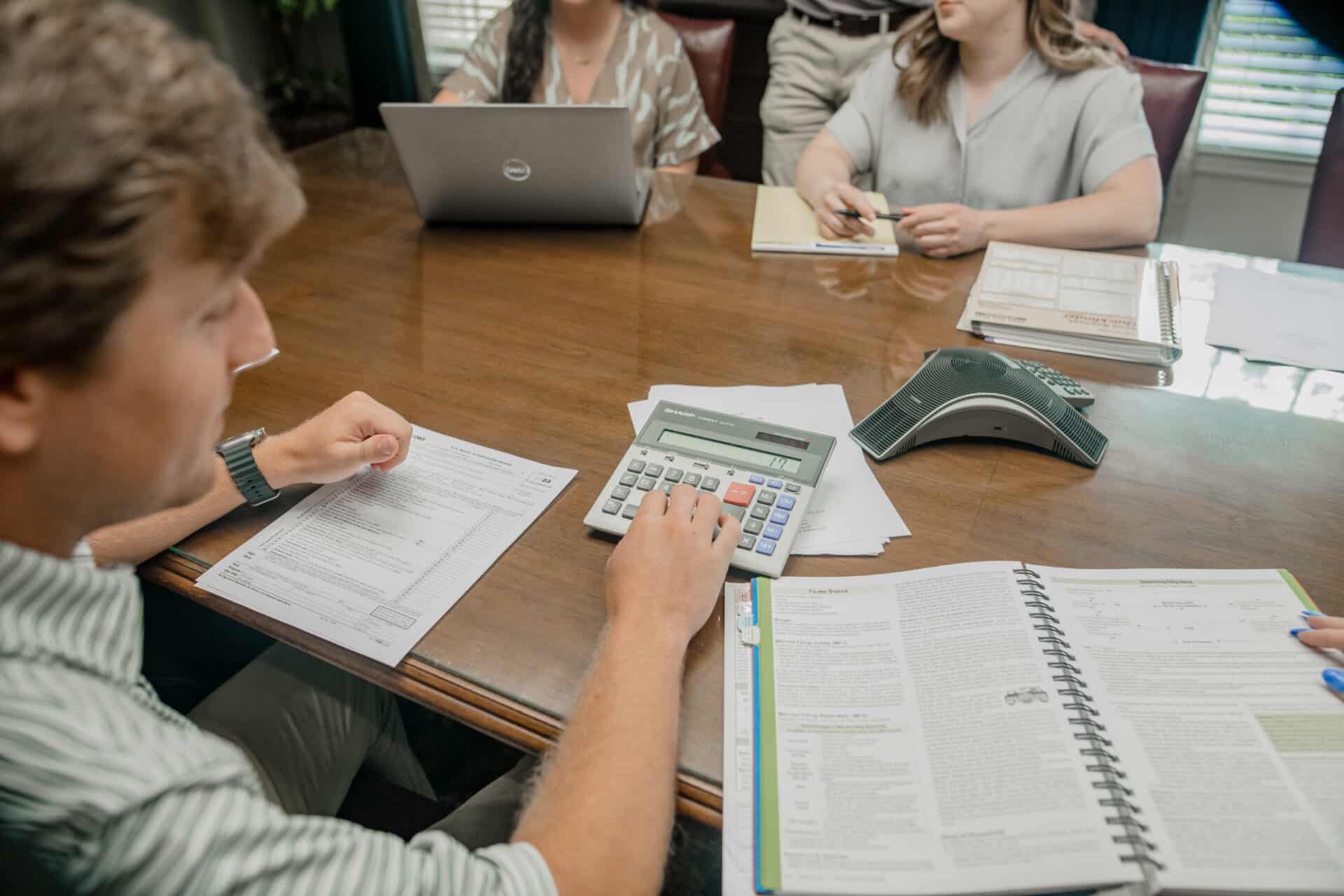 group of people reviewing data in a conference room