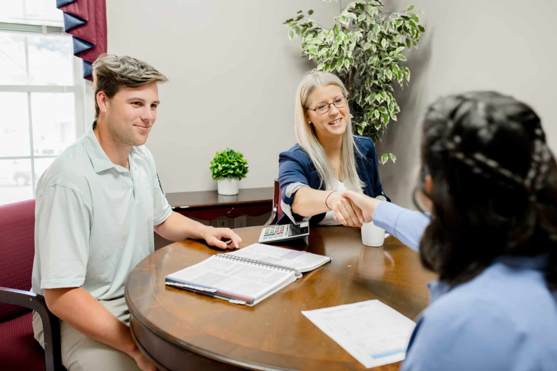 male an female talking to female client